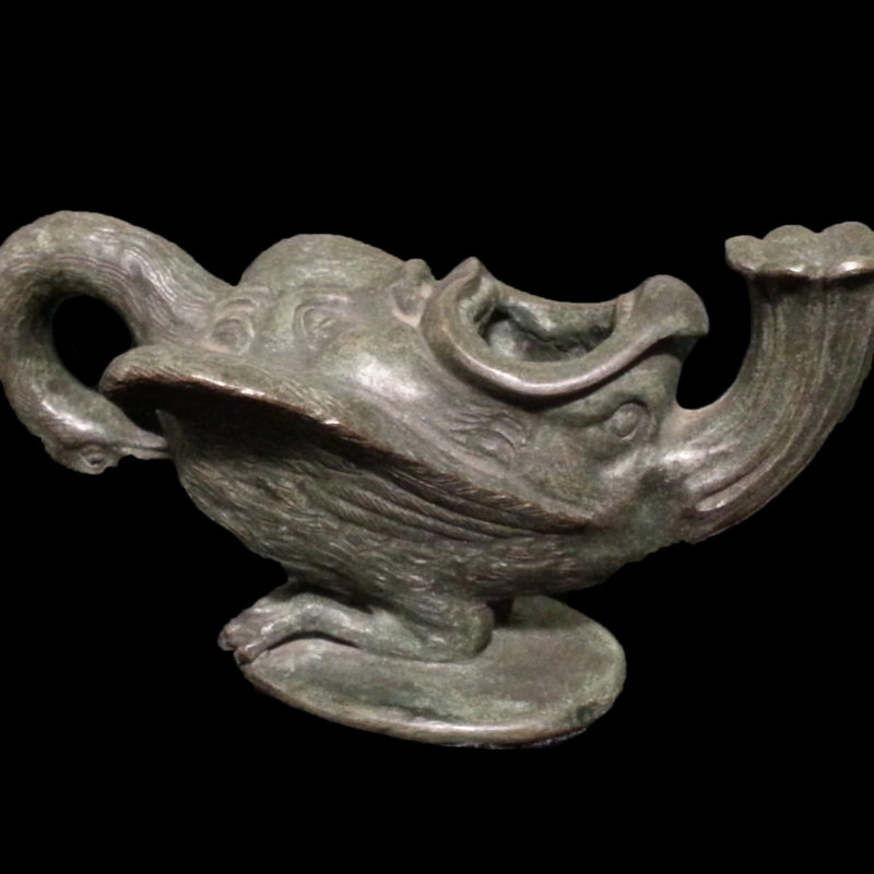 swan oil lamp with pathos drama mask on its back