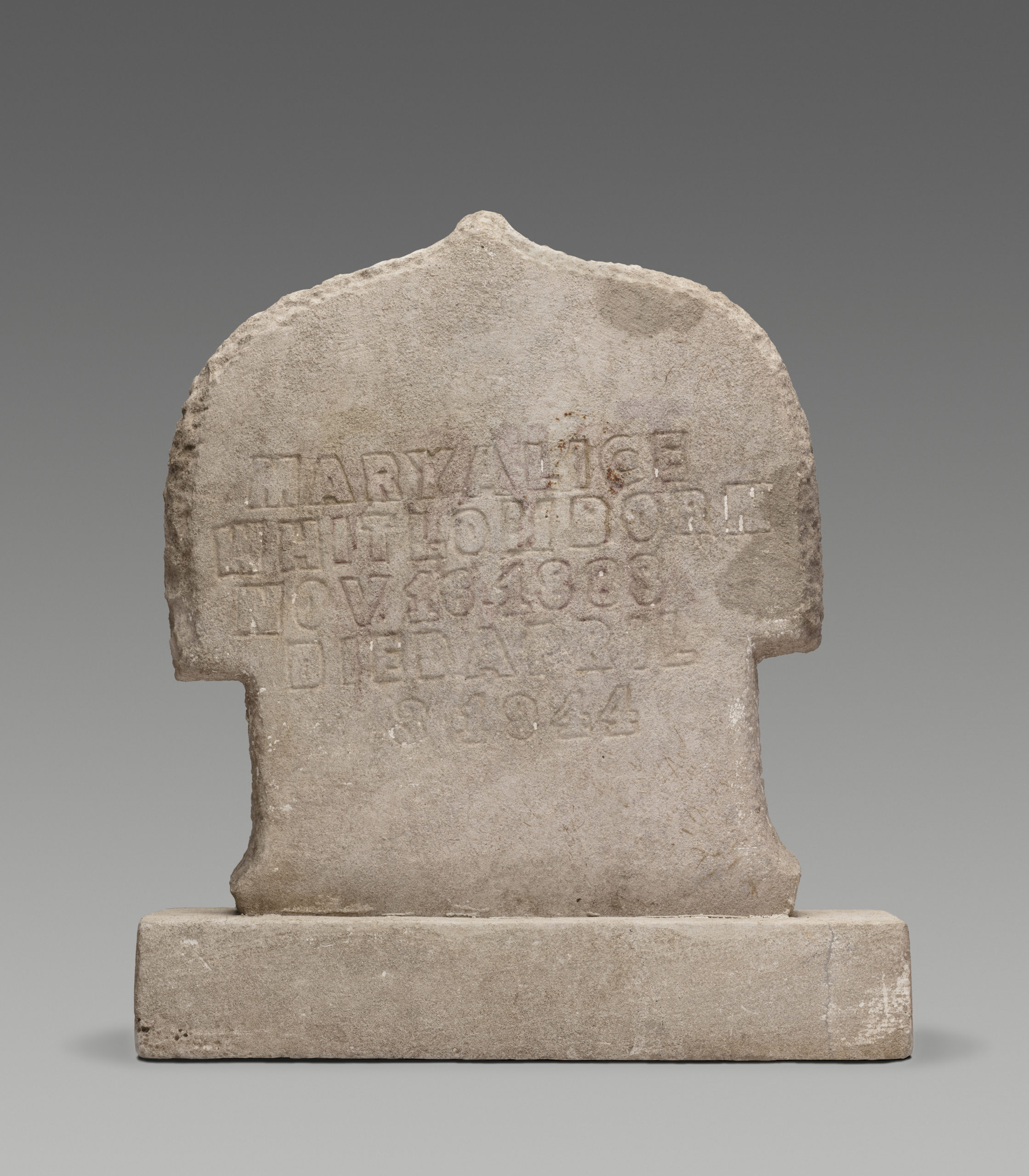 Limestone tombstone carved by William Edmondson. Etching in limestone says Mary Alice Whitlow, Born Nov. 16, 1888