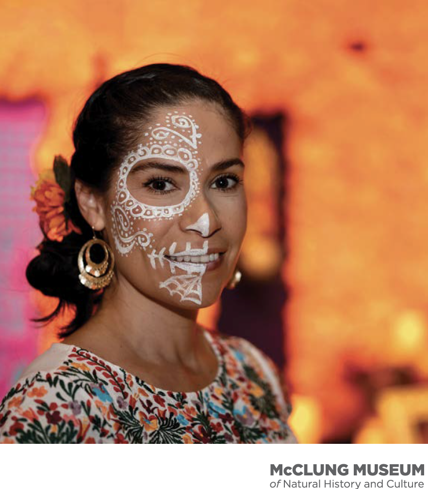 Cover of 2023 Annual Report shows image from "Spirit of Día de los Muertos" exhibition with bright orange background.
